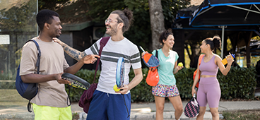 A group of friends chatting after playing pickleball