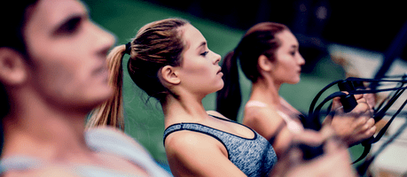 group of fit people training in a gym