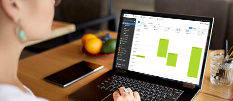woman using recreation management software on her laptop