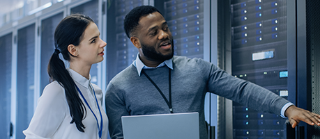 man and woman checking server security